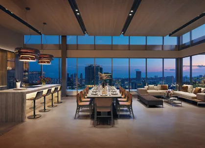 Union Square Residences, artist’s impression: Club Union on level 34, a function room with a kitchen island, dining table and lounge facing the city at dusk