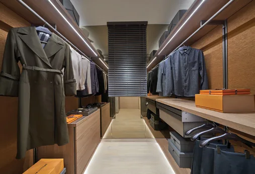 Union Square Residences, for illustration only: walk-in closet with open hanging rails and lit shelving
